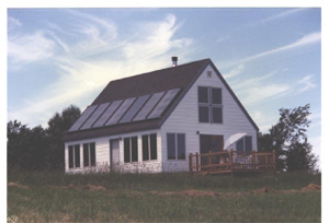 Photograph of a House with Solar Collectors on the roof