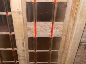 Installed aluminum heat transfer plate for radiant floor heat.