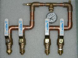 Radiant heating tubing manifold for wall mounting.