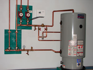 A radiant heating system powered by an ultra high efficiency condensing water heater.